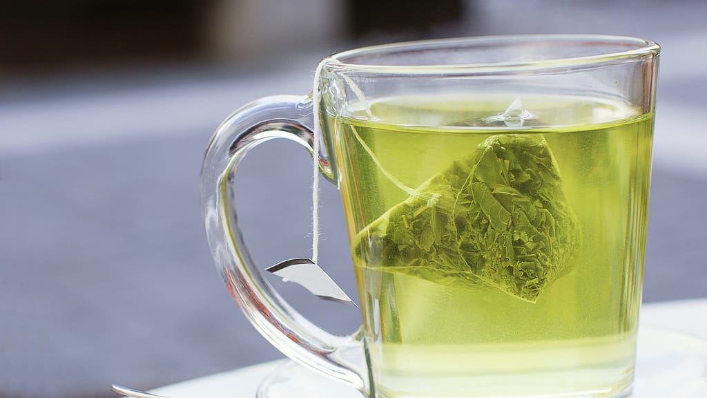 "Green Tea Rinse: Invigorate your locks with the antioxidant-rich essence of green tea. Nourish your hair naturally for a healthy, vibrant shine."