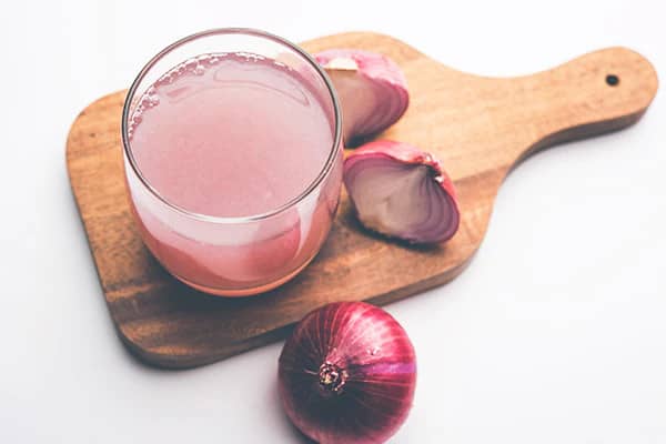 Onion Juice Power: Tap into the strength of onion juice, rich in sulfur, to stimulate hair growth and fortify your locks naturally."